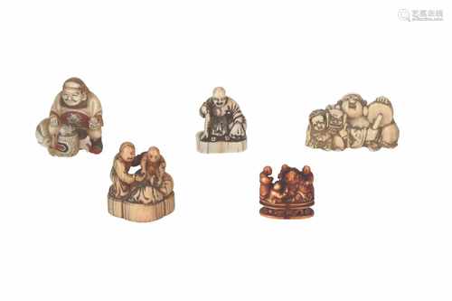 Lot of five netsuke, 1) Wood with lacquer, shishi head with copper eyes. H. 3 cm. 2) Wooden shishi