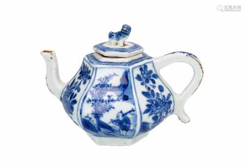 A hexagonal blue and white porcelain miniature teapot, decorated with flowers and landscapes. The