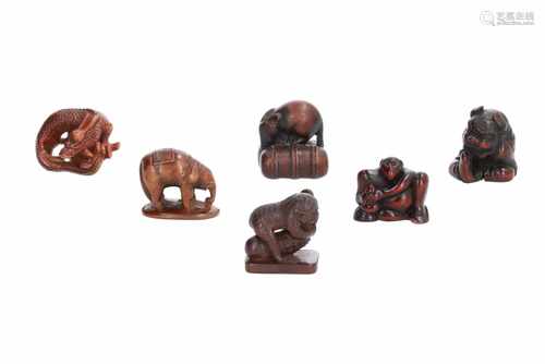 Lot of six netsuke, 1) Wooden Kappa with cucumber. Signed Ryukei. H. 3 cm. 2) Wooden elephant on