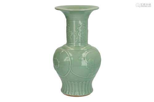 A large Longquan celadon trumpet-necked porcelain vase, decorated with flowers in relief.