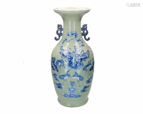 A green glazed porcelain vase with blue and white decor of flowers and birds. Unmarked. China,