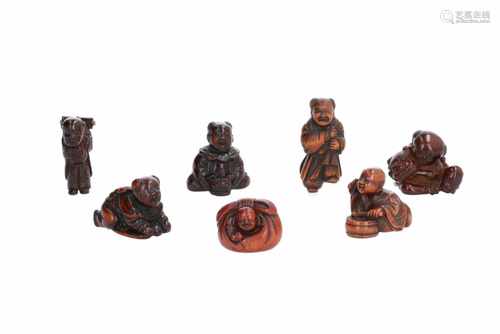 Lot of seven netsuke, 1) Wooden Hotei in bag. H. 2,5 cm. 2) Wooden karako with shishi mask.