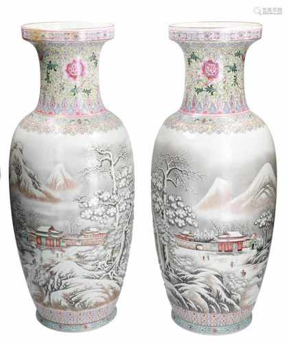 A pair of polychrome porcelain vases, decorated with mountainous winter landscape with houses, trees