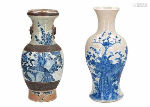 Lot of two blue and white porcelain vases, decorated with 1) peacocks and flowers. Marked with 4-