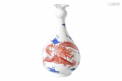 An blue and white with iron red porcelain vase, decorated with dragon and clouds. Marked with seal