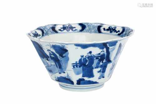 A hexagonal blue and white porcelain bowl with scalloped rim, decorated with figures in a garden and