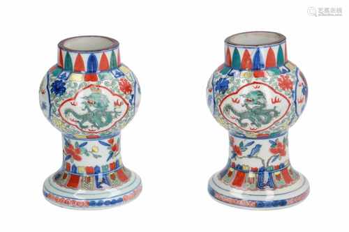 A pair of Wucai porcelain vases, decorated with dragons, flowers and birds. Marked with 6-