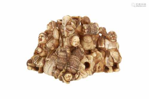 Ivory okimono of 13 figures including the seven lucky gods on a bag and rock. Signed Masayoshi.