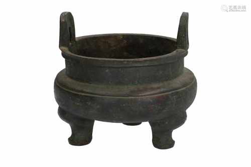 A bronze tripod censer with carved ring around the belly and two handles. Unmarked. China, 18th/19th