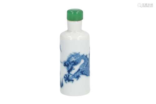 A blue and white porcelain snuff bottle with jade stopper, decorated with dragon chasing the burning