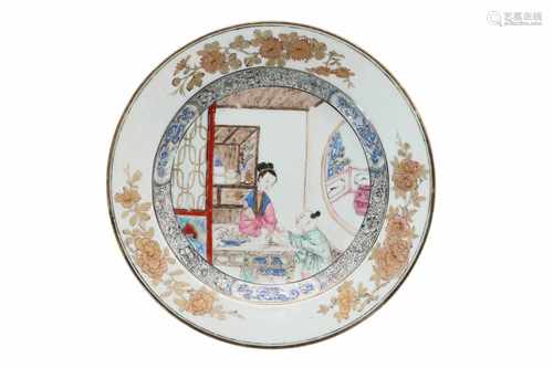 A polychrome export porcelain dish, decorated with an interior with a lady holding a peach and a boy