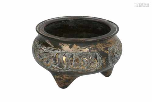 A tripod bronze insence burner with Arabic text 'There is only one god and that is Allah, Mohammed