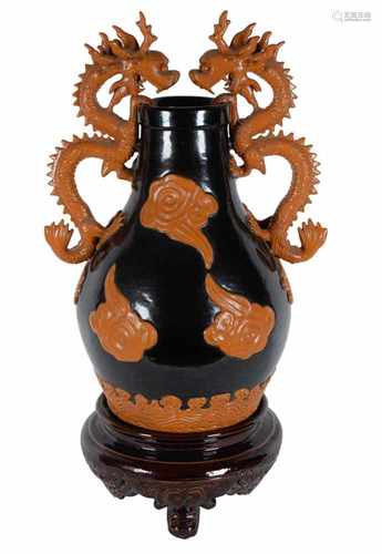 A black and brown raindrop glazed Yu Dian Yao porcelain vase. The handles in the shape of dragons.