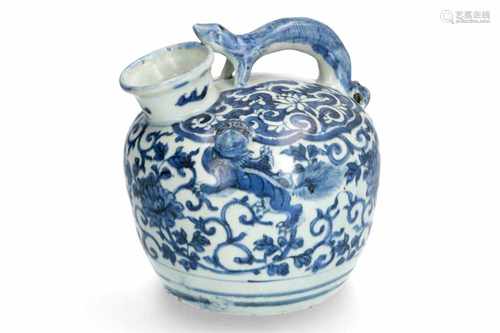 A blue and white porcelain jar with handle in the shape of an animal, decorated with flowers and