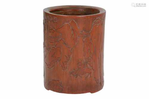 A bamboo brushpot with relief decor of figures riding animals in a landscape. Signed. China, 18th/