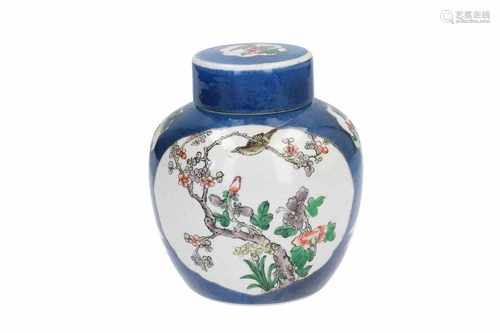 A powder blue porcelain lidded jar with Famille Verte decor of reserves with tea drinking figures