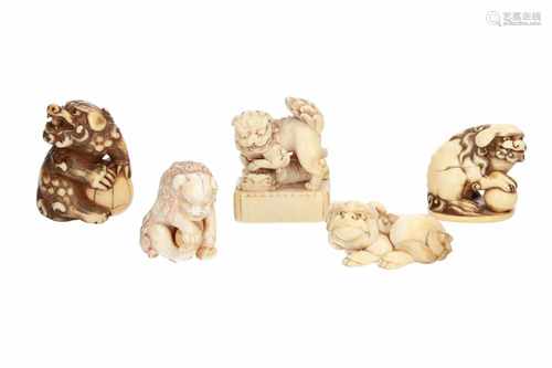 Lot of five netsuke, 1) Ivory shishi with ball. H. 4 cm. 2) Ivory shishi with ball. Signed