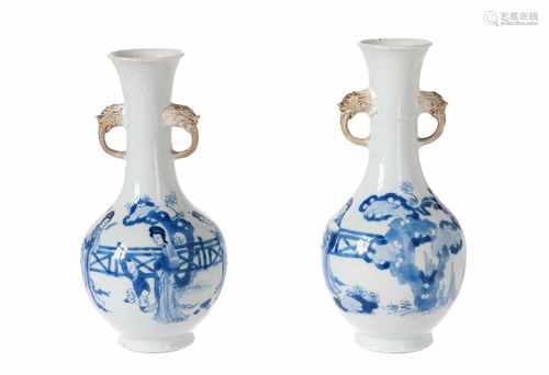 A pair of blue and white porcelain vases, decorated with long Elizas and little boys. Market with