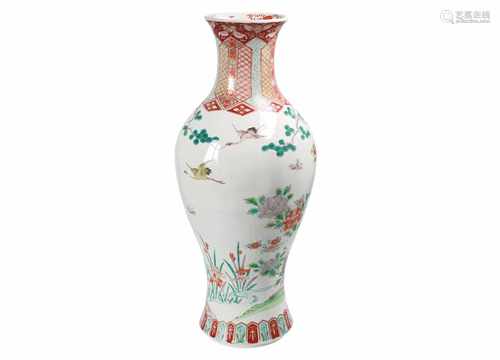 An Imari porcelain vase, decorated with flowers and trees. Unmarked. Japan, 19th century. H. 62 cm.