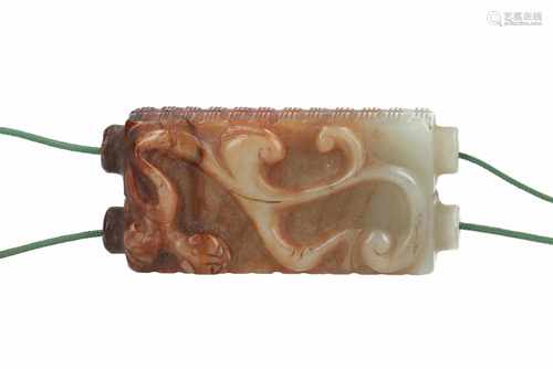 A jade pendant in the shape of a double cong with relief decor of an animal. China, 17th/18th