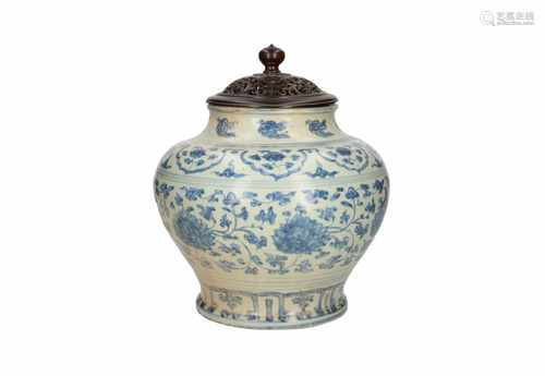 A blue and white porcelain vase with floral decor. Unmarked. With later base and lid. China, Ming.