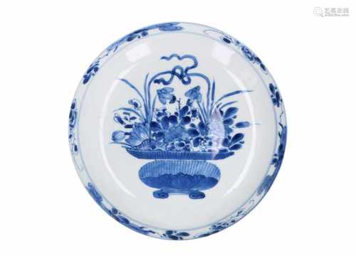 A blue and white porcelain dish, decorated with flowers in a basket. Marked with symbol Shuanshu.