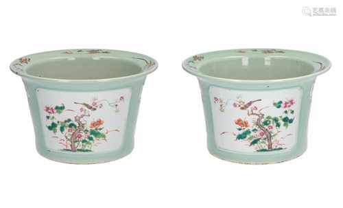 A lot of two polychrome porcelain cachepots, decorated with flowers and birds. Unmarked. China,