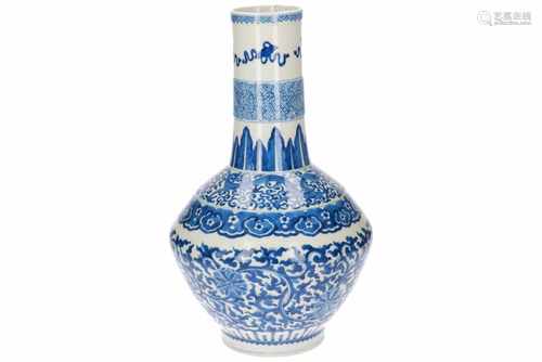 A blue and white porcelain longneck vase, decorated with dragons, flowers and antiquities. Unmarked.