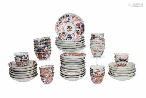 A lot of 30 polychrome porcelain cups and 29 saucers, with decors including flowers, birds and