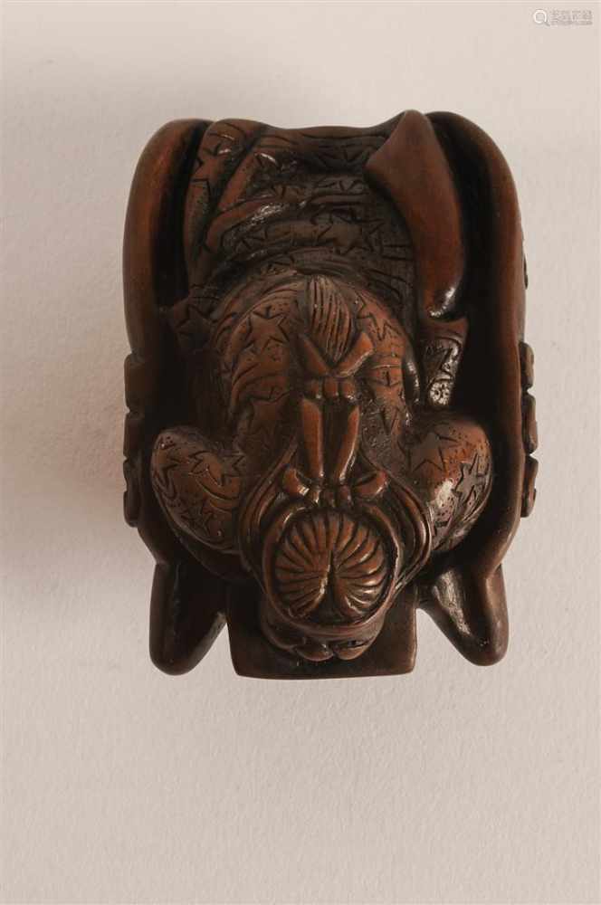 Lot of four netsuke, 1) Wooden Oni mask and samurai. H. 6 cm. 2) Wooden ...