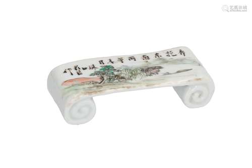 A polychrome porcelain scroll shaped brush rest, decorated with landscape and characters. Dated