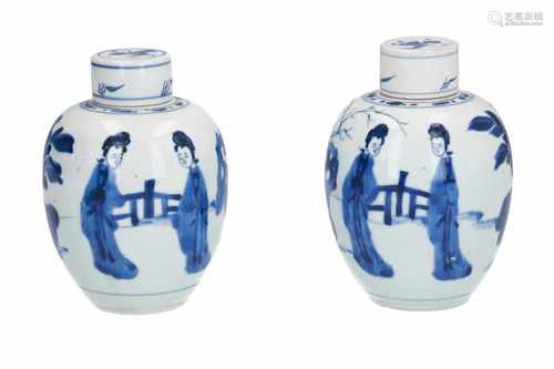 A pair of blue and white porcelain caddies with flat lids, decorated with long Elizas. The lids with