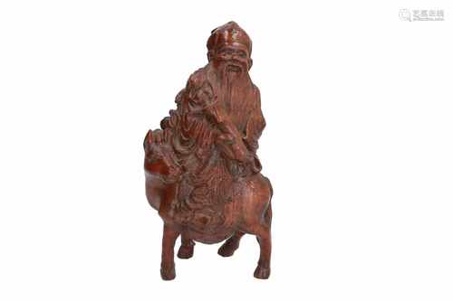 A carved bamboo sculpture of one of the eight immortals (Zhang Guolao) riding his mule. China,