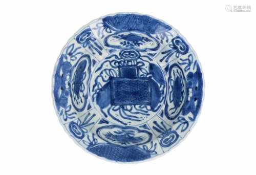 A blue and white porcelain 'klapmuts' bowl, decorated with incense burner, flowers and fruits.