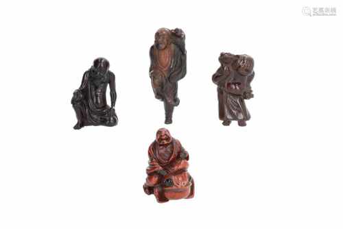 Lot of four netsuke, 1) Wooden Gama Sennin with toad. H. 6,5 cm. 2) Wooden Gama Sennin with toad. H.