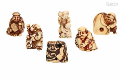 Lot of one netsuke and three manju, 1) Ivory netsuke, two dragons in the clouds. Signed