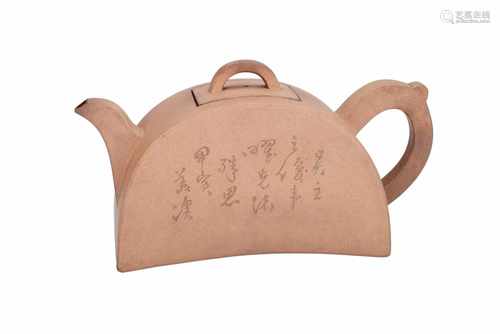 A Duanni Yixing teapot with flat sides, decorated with characters and a bird on branch. Marked