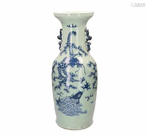 A green glazed vase with blue and white decor of a dragon, burning pearl and fish. Unmarked.