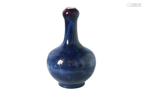 A blue flambé glazed porcelain longneck vase. Unmarked. China, 20th century. H. 31 cm.