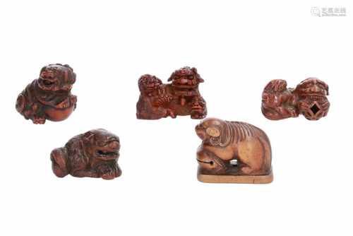 Lot of five netsuke, 1) Wooden sitting shishi with ball. H. 3,5 cm. 2) Wood with lacquer, shishi