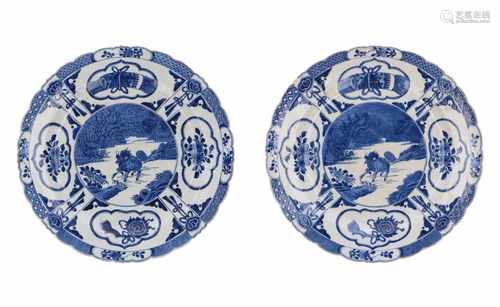 A lot of two blue and white porcelain dishes decorated with a Qilin and phoenix. Unmarked. China,