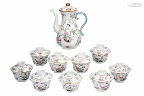 A lot of nine lidded cups, one extra lid and a teapot, decorated with flowers and birds. Marked with