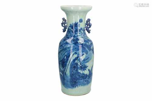 A blue and white porcelain vase with two handles, decorated with a peacock and flowers. Unmarked.