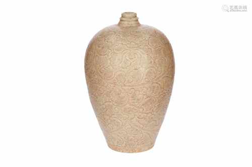 A gray-white glazed yingqing Meiping vase with carved floral decor. China, Song or later. H. 33 cm.