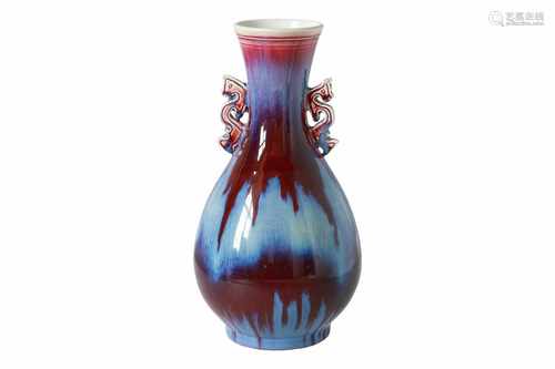 A flambé glazed porcelain vase, with handles in the shape of dragons. Marked with 6-character mark