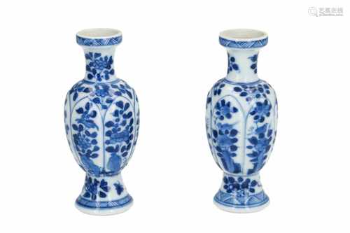 A pair of blue and white porcelain miniature vases, decorated with flowers and birds. Unmarked.