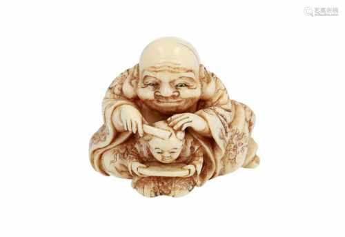 Ivory netsuke of Hotei with karako. Signed. Japan, ca. 1850. H. 3 cm. Please note: we don't ship