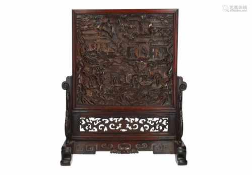 A wooden and soapstone table screen, decorated to one side with a landscape with figures and