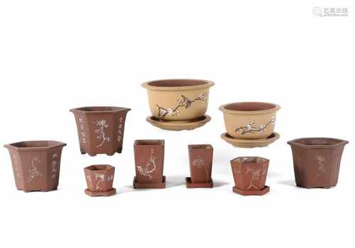 A lot of nine diverse Yixing jardinières, of which six with dish. China, 20th century.