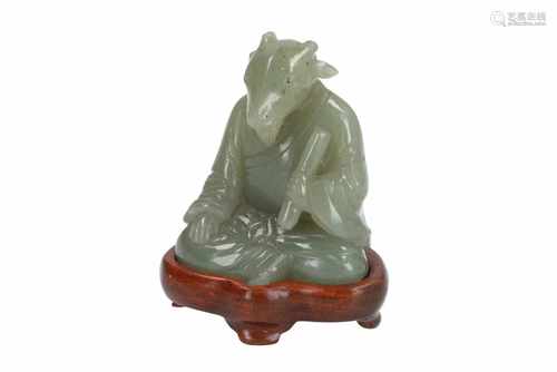 A celadon jade zodiac figure of a ram, on wooden base. China, 18th/19th century. H. excl. base 5